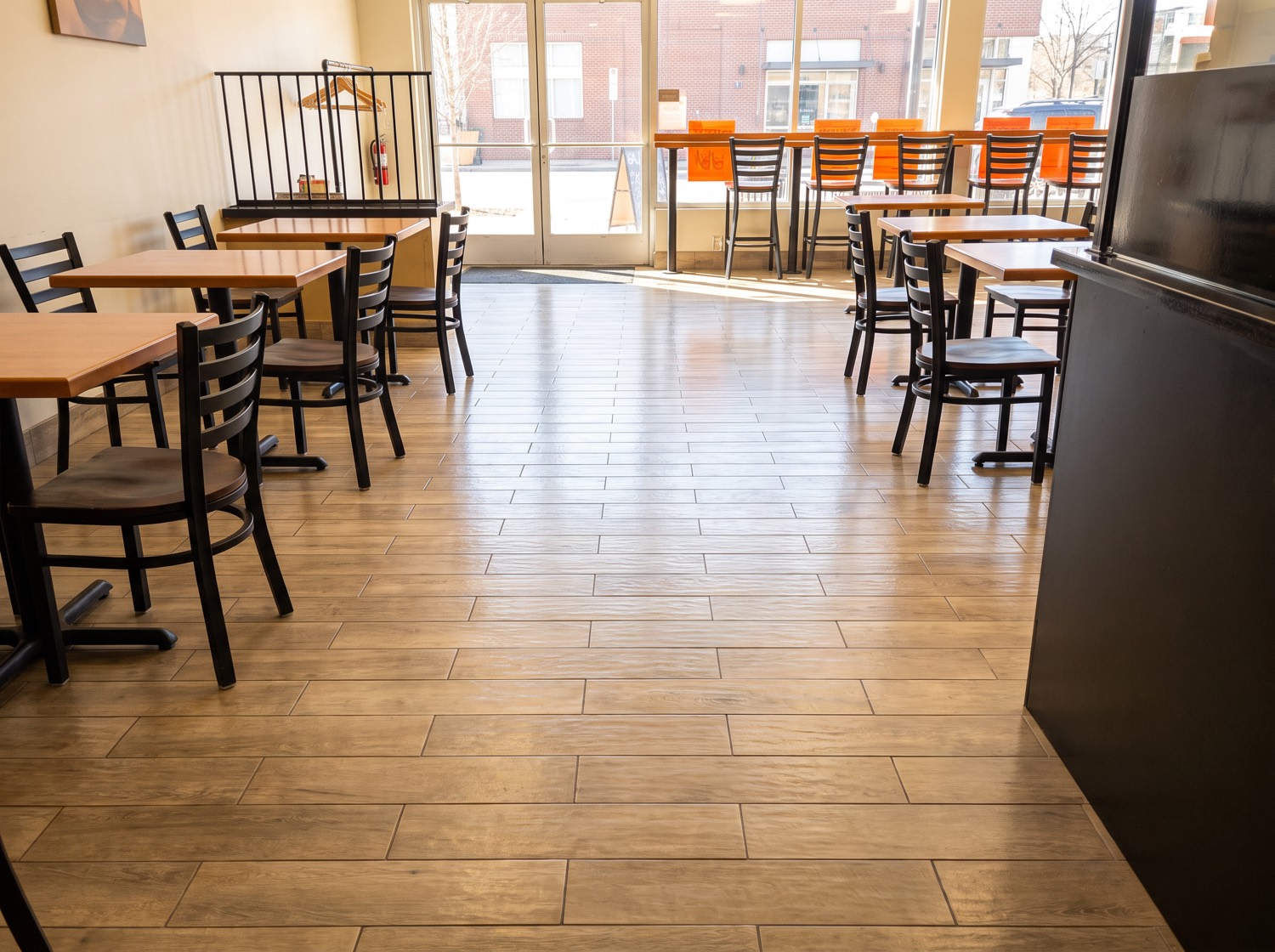 Bright, clean commercial dining room floor after professional cleaning