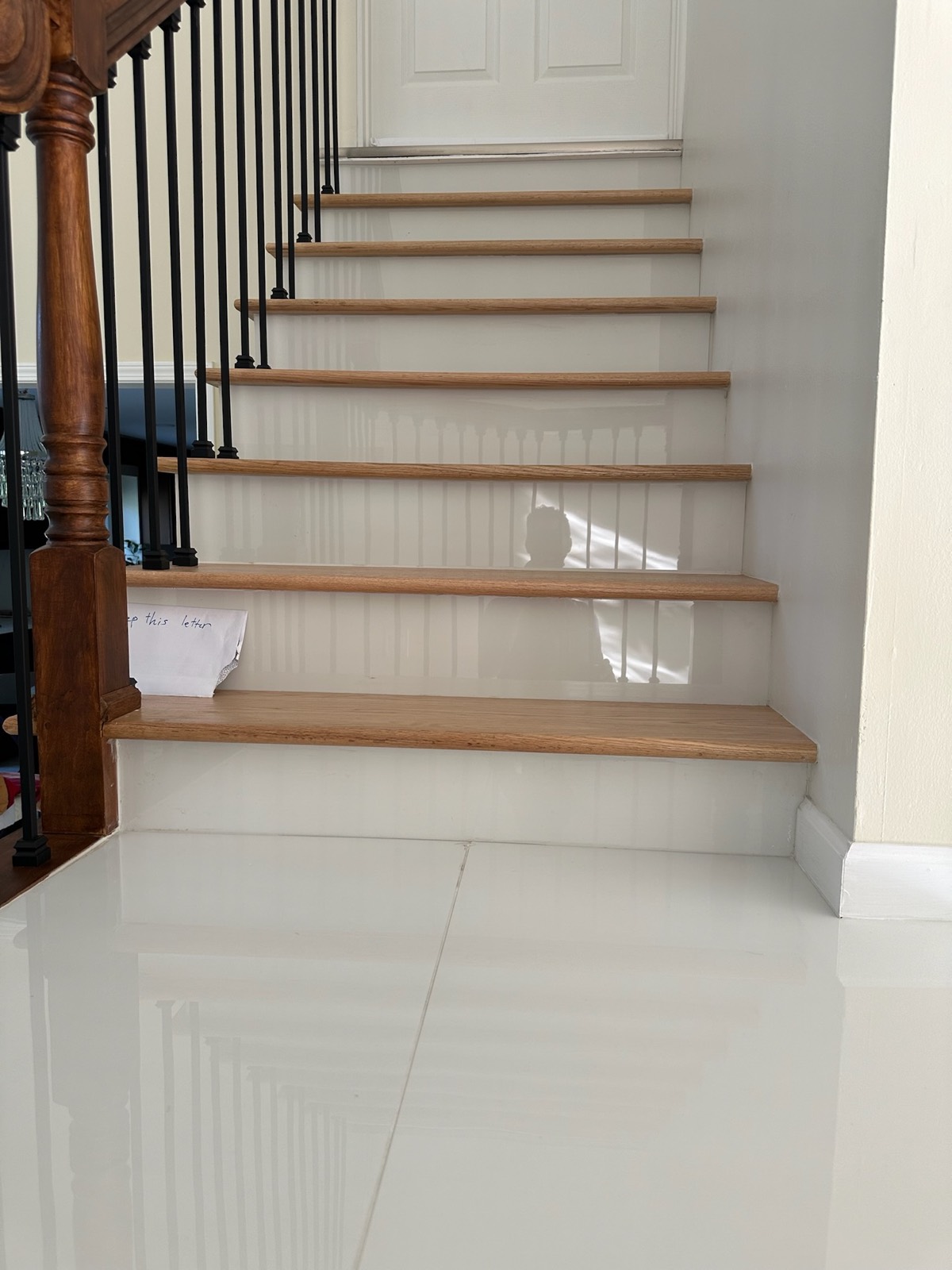 White-oak tread staircase with tile floor landing